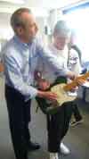 2009 Aylesford School Francis helping one of the kids play his No.1 Telecaster guitar